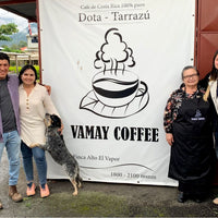 The Solis family with Mayra in front of their sign on their property in Costa Rica